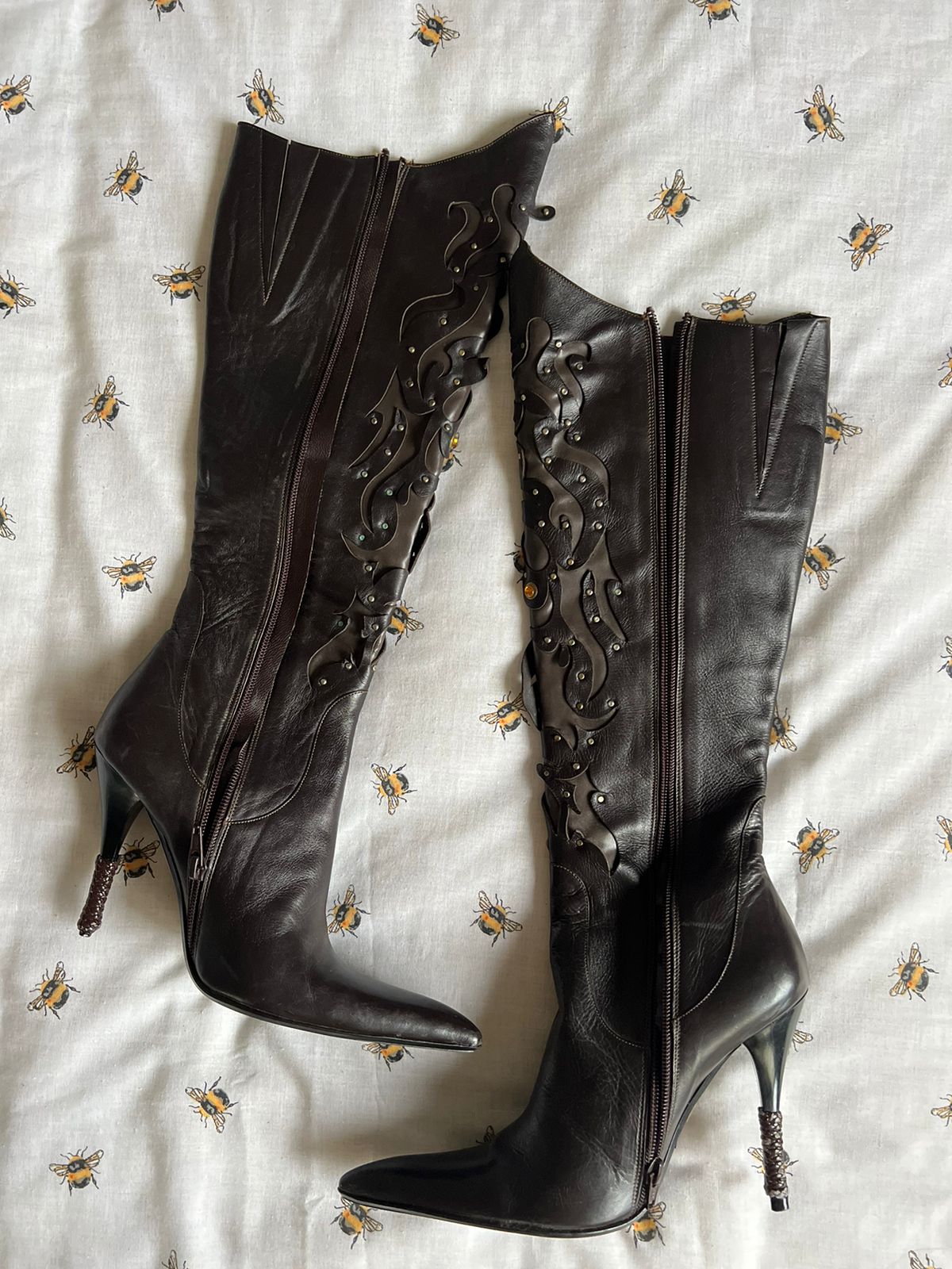 Brown leather knee high pointy heeled boots