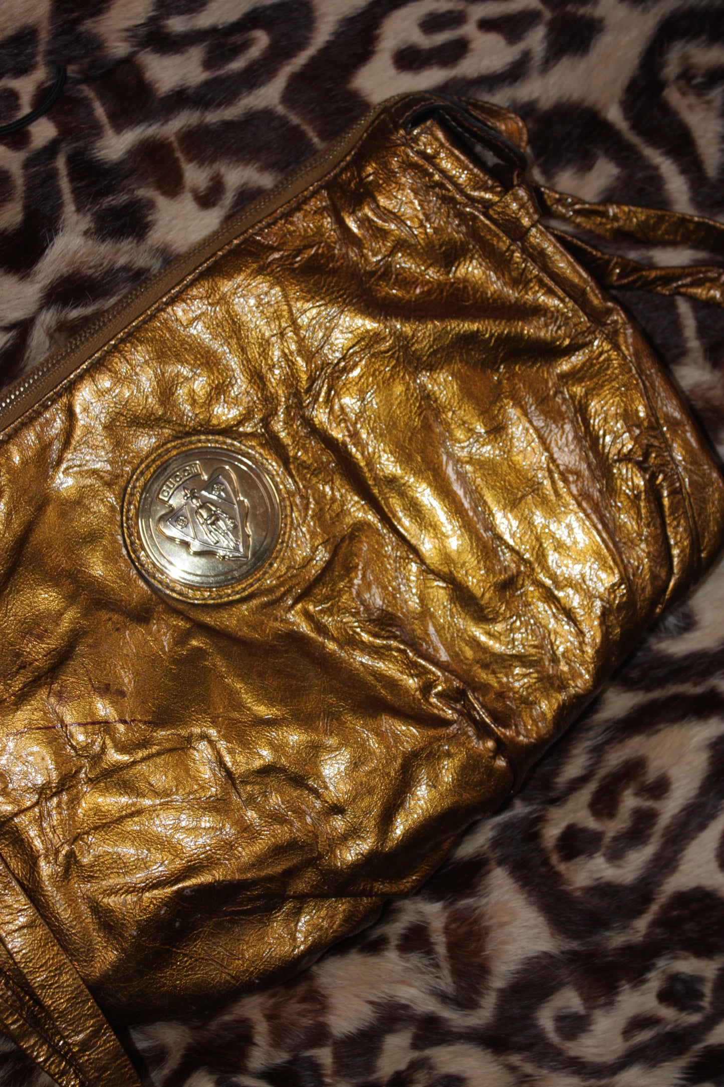 Gucci metallic gold clutch leather bag