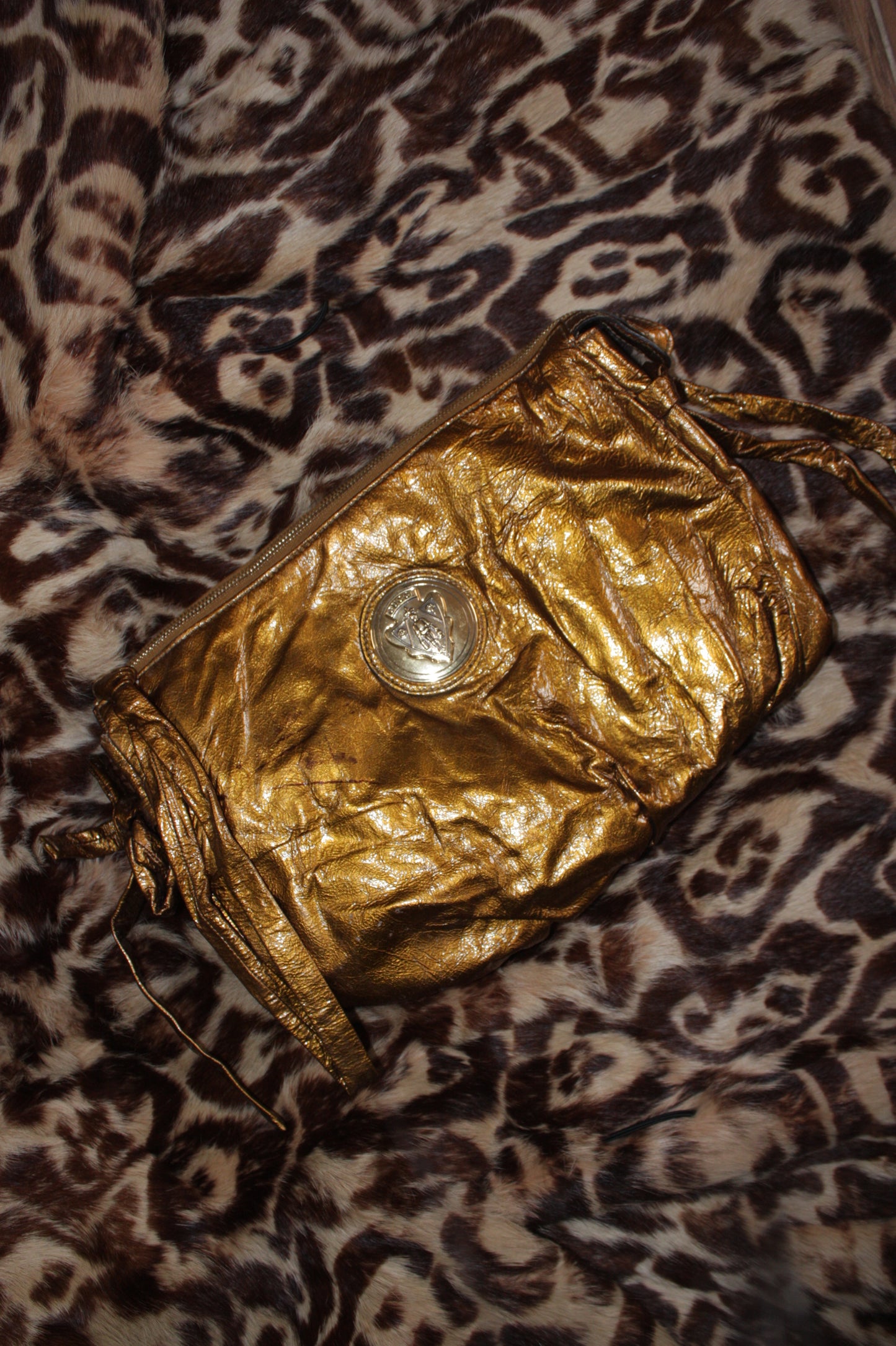 Gucci metallic gold clutch leather bag