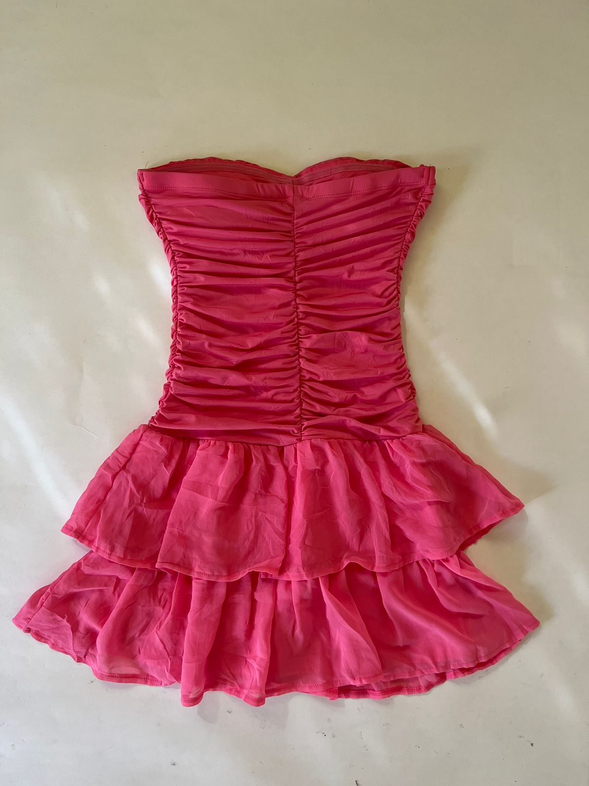 Pink ruched mini sleeveless padded dress