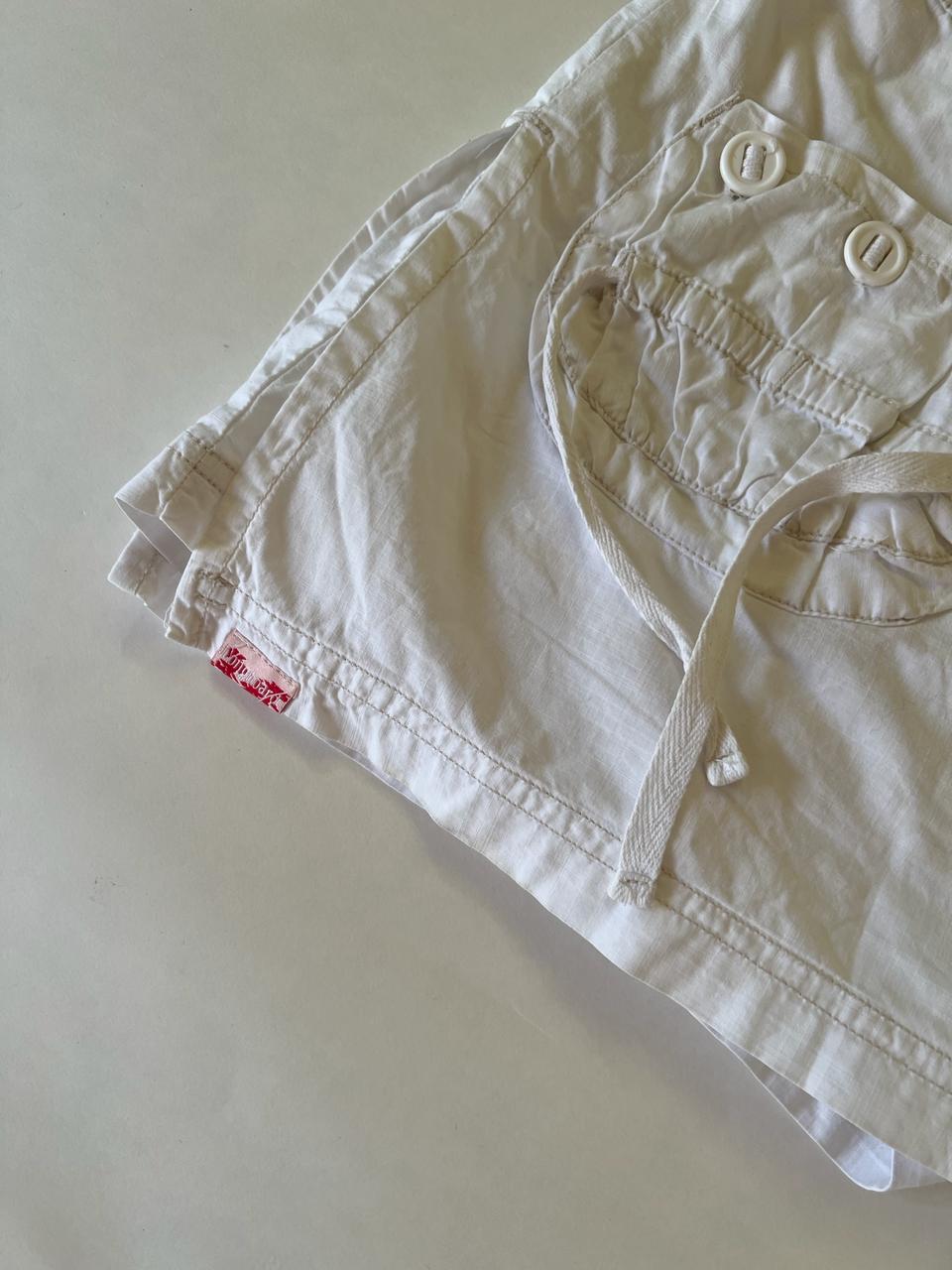 White denim mini cargo skirt with shorts underneath