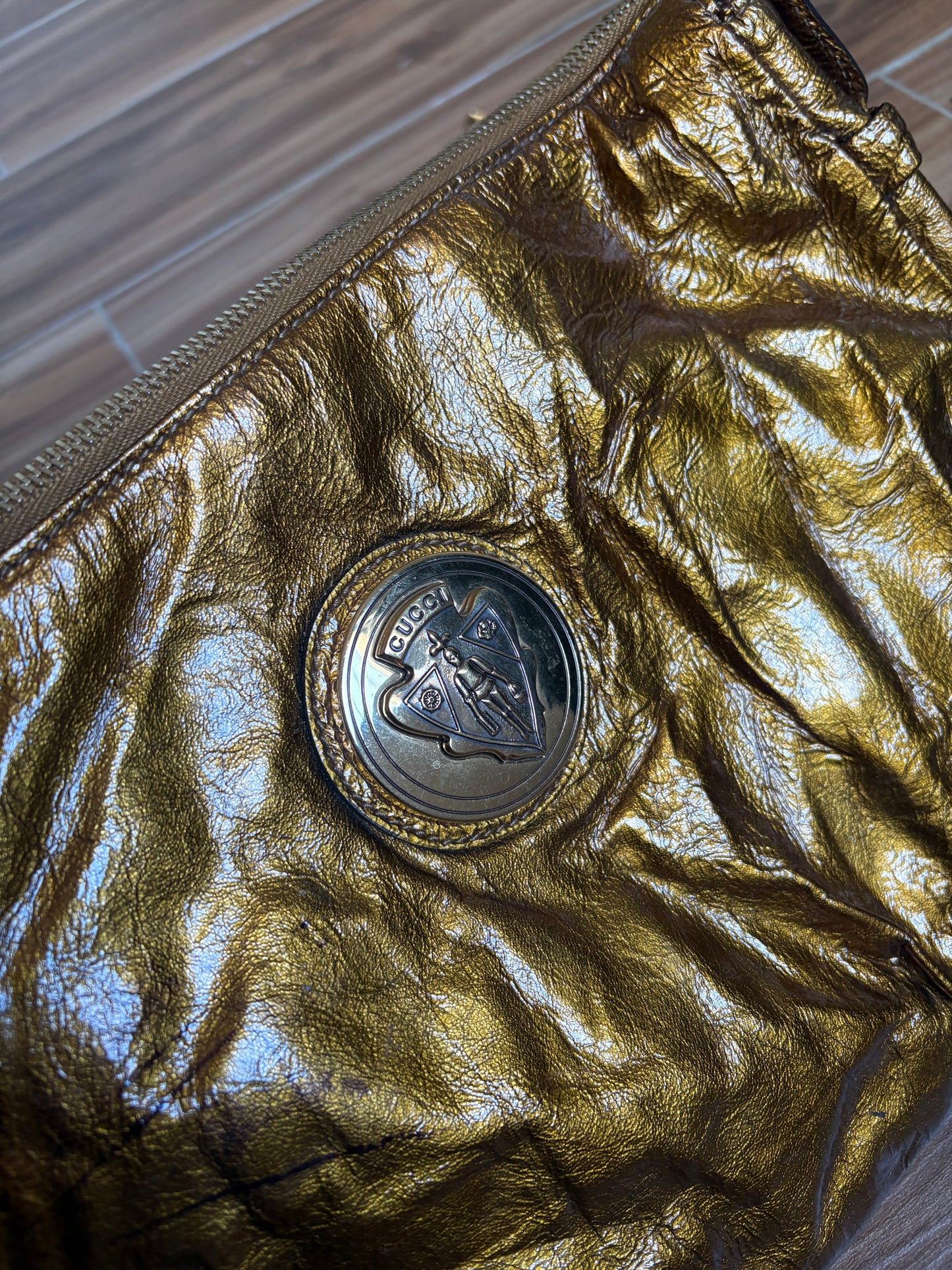 Gucci metallic gold clutch leather bag