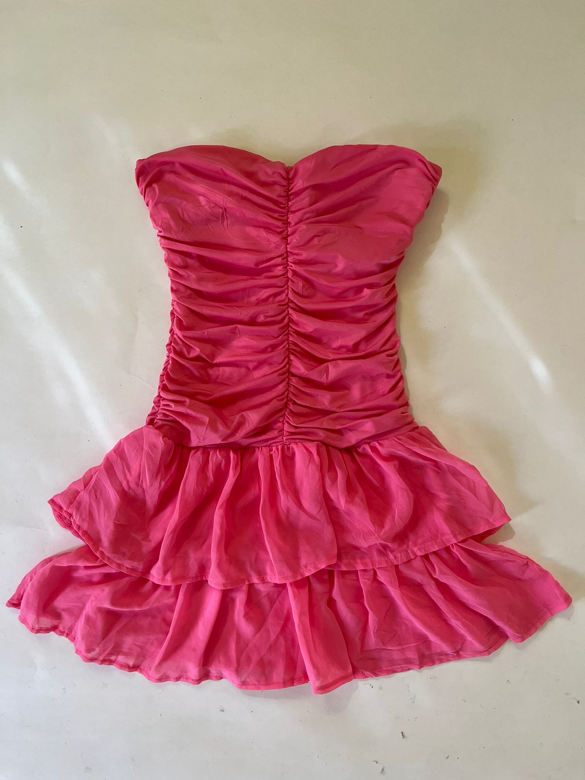 Pink ruched mini sleeveless padded dress