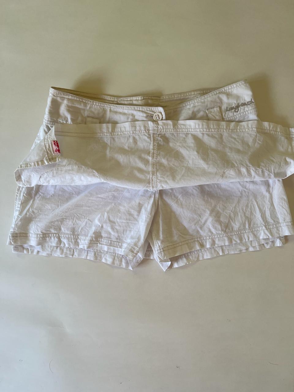 White denim mini cargo skirt with shorts underneath