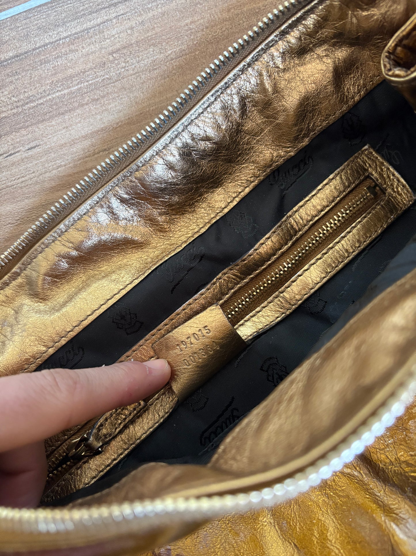 Gucci metallic gold clutch leather bag