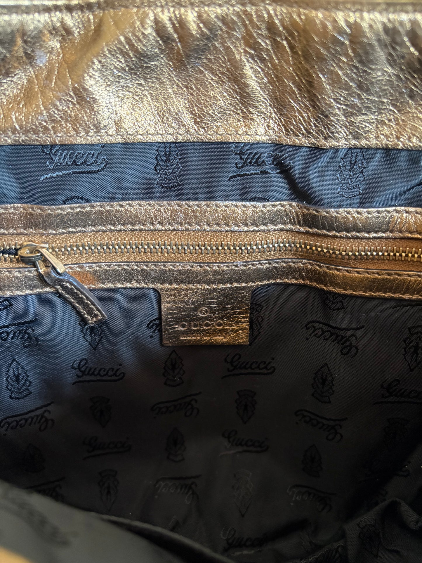 Gucci metallic gold clutch leather bag